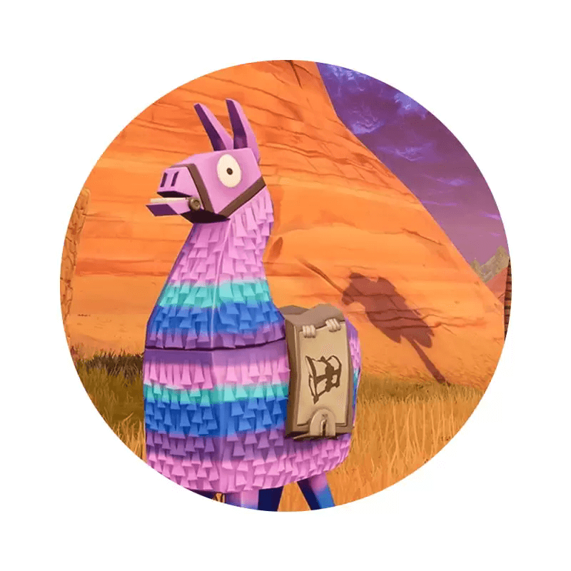 Farverig llamaprinterskabel in 3D-stil foran ørkenlandskab.